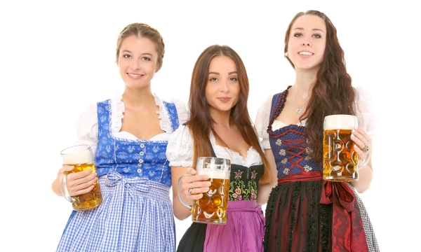 Waitresses at Oktoberfest Holding Beers